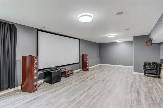 a view of a room with wooden floor and stairs