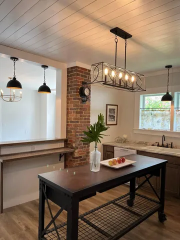 a dining room with a table and chairs