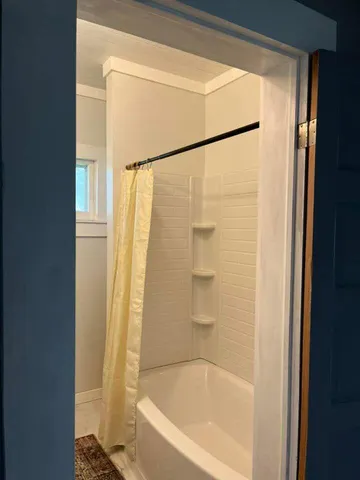 a bathroom with a bathtub