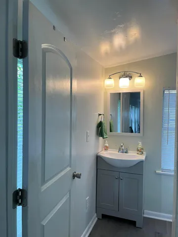 a bathroom with a double vanity sink and mirror