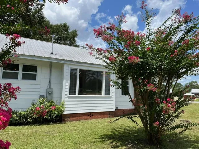 a house view with a garden space