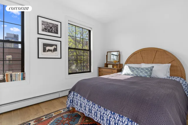 a view of a chairs and table in the back yard of the house