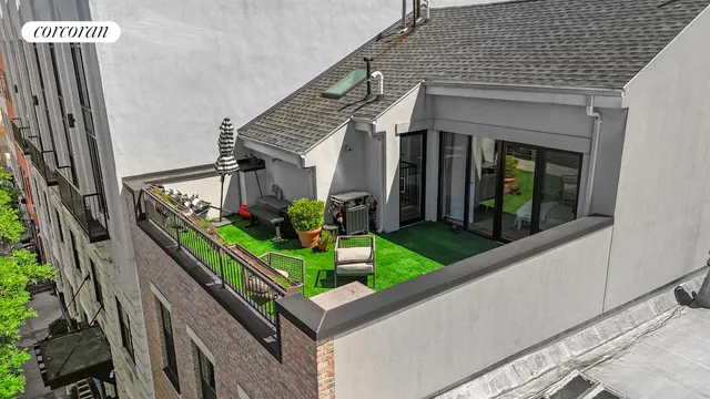 a buildings with a table and chairs in front of it