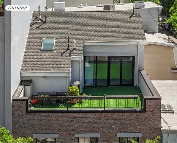 a front view of house with an outdoor seating