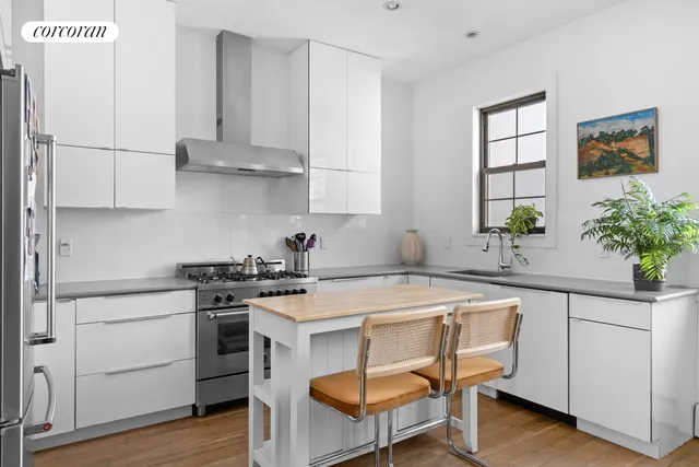 a dining room with a table and chairs