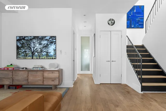 a kitchen with a stove a table and chairs in it