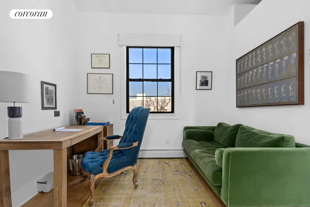 a bedroom with a large bed and a large window