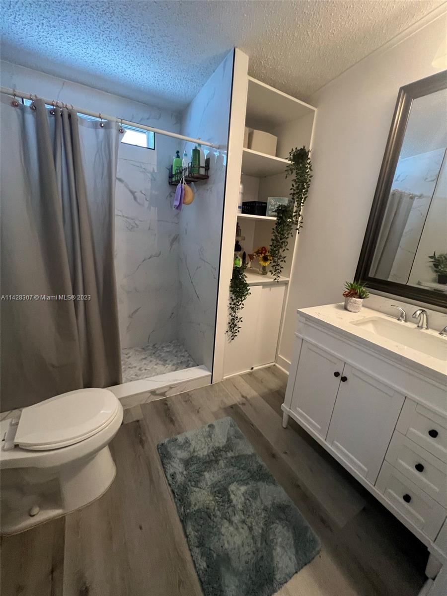 Gateway Estates Park Homestead, FL 33034 - Photo 14 of 26 a bathroom with a sink and a mirror