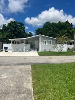 Gateway Estates Park Homestead, FL 33034 - Photo 2 of 26 a house view with a garden space