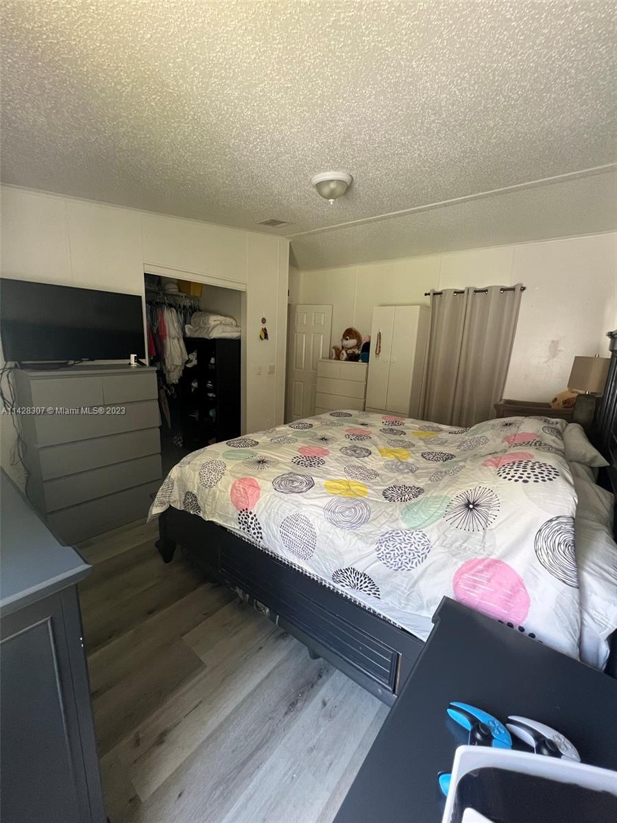 Gateway Estates Park Homestead, FL 33034 - Photo 24 of 26 a bedroom with a bed and a television