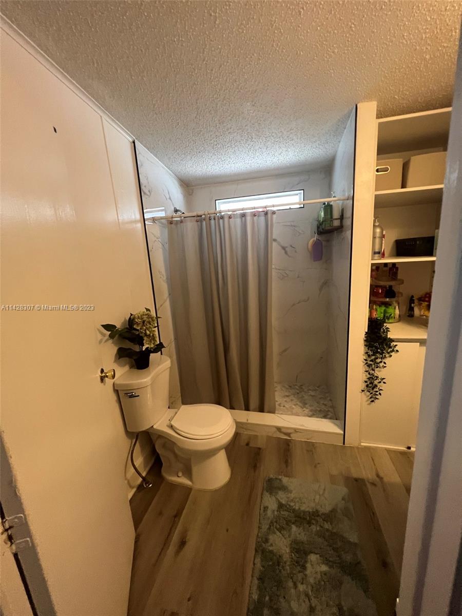 Gateway Estates Park Homestead, FL 33034 - Photo 26 of 26 a bathroom with a shower and a toilet