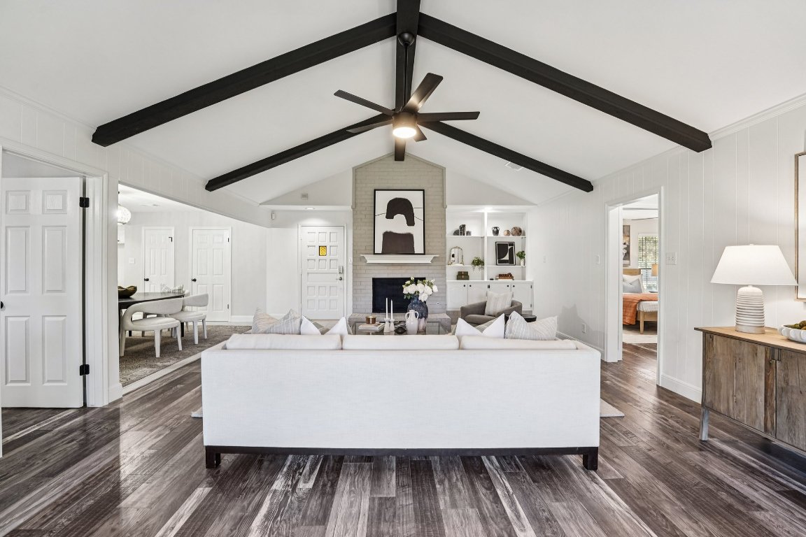 5307 Beckett Circle Austin, TX 78749 - Photo 3 of 29 Living room with dark wood finished floors, a brick fireplace, and a ceiling fan