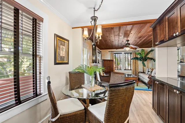a view of a dining room with furniture window and outside view