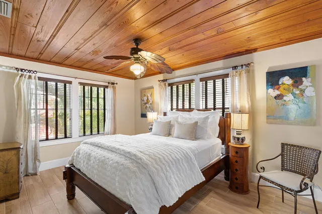 a bedroom with a large bed and a window