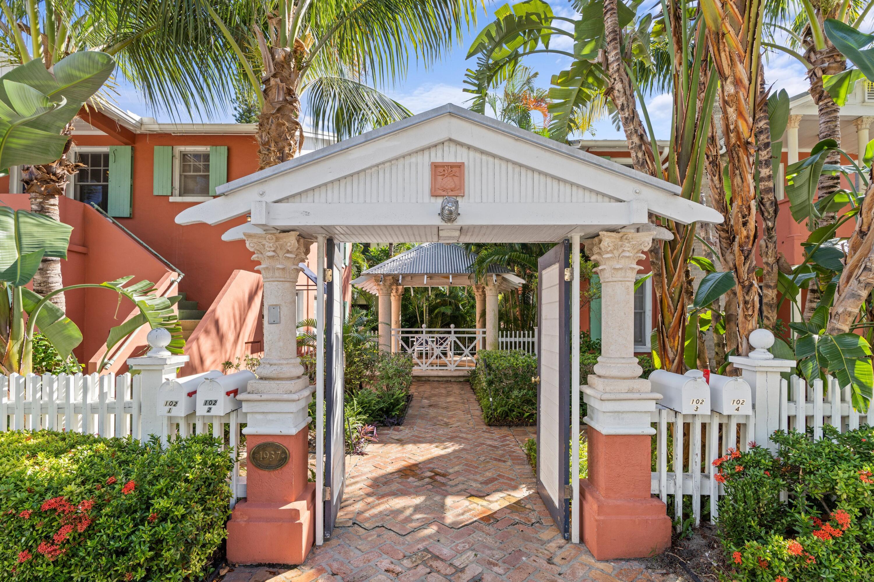 102 Southeast 7th Avenue, Unit VILLA 4 Delray Beach, FL 33483 - Photo 3 of 23 front view of a house with a porch