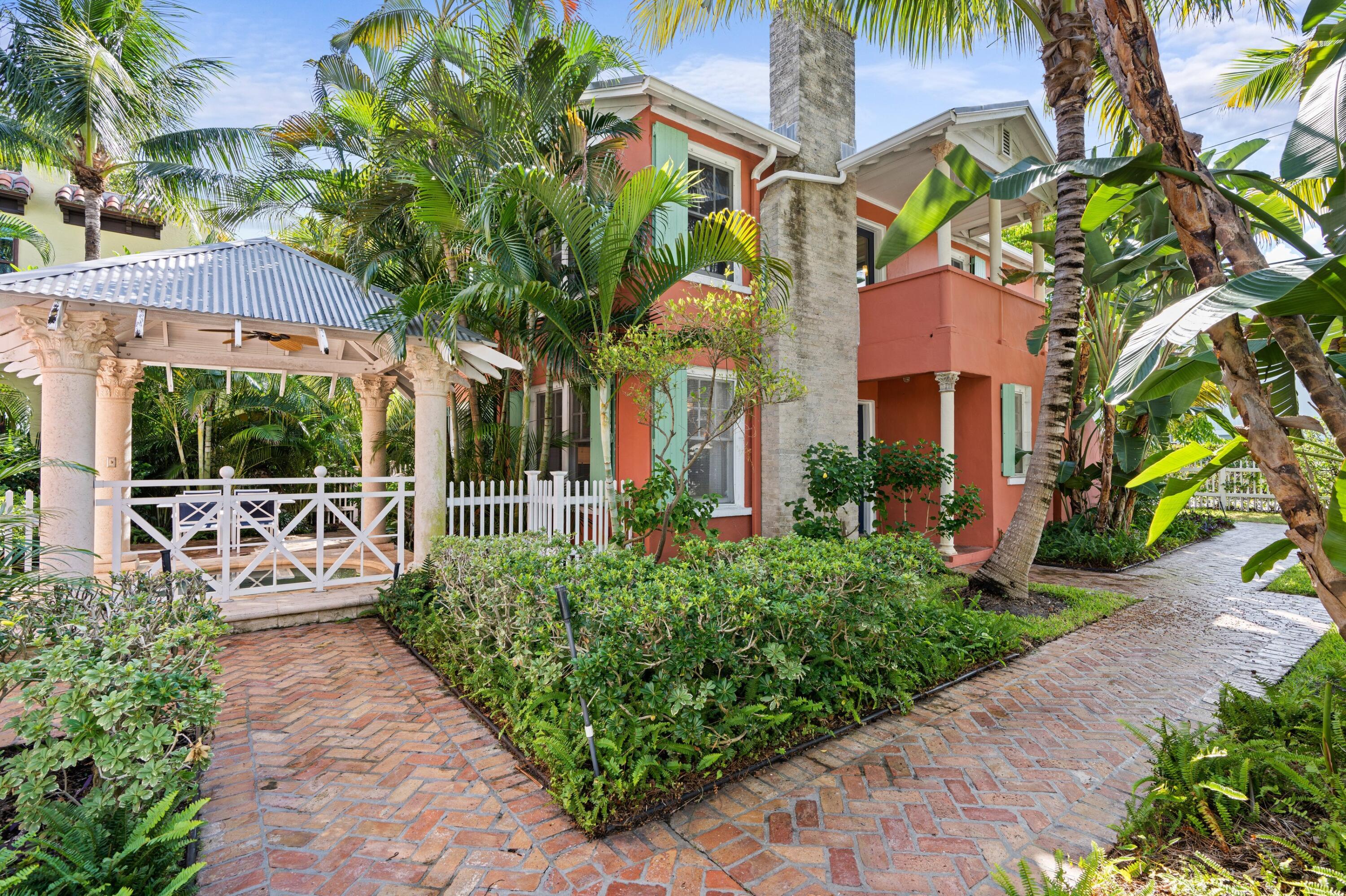 102 Southeast 7th Avenue, Unit VILLA 4 Delray Beach, FL 33483 - Photo 4 of 23 a view of a patio with table and chairs and potted plants