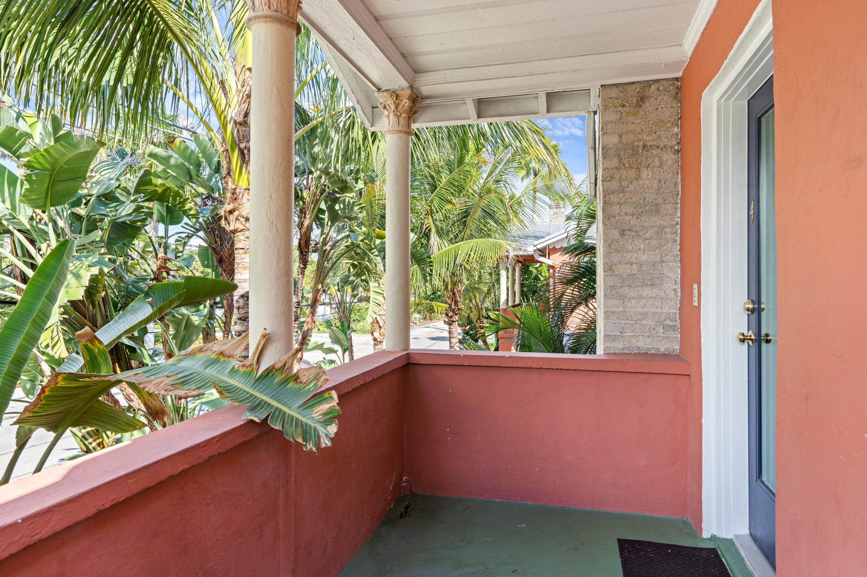 102 Southeast 7th Avenue, Unit VILLA 4 Delray Beach, FL 33483 - Photo 6 of 23 a room with a window and a tree