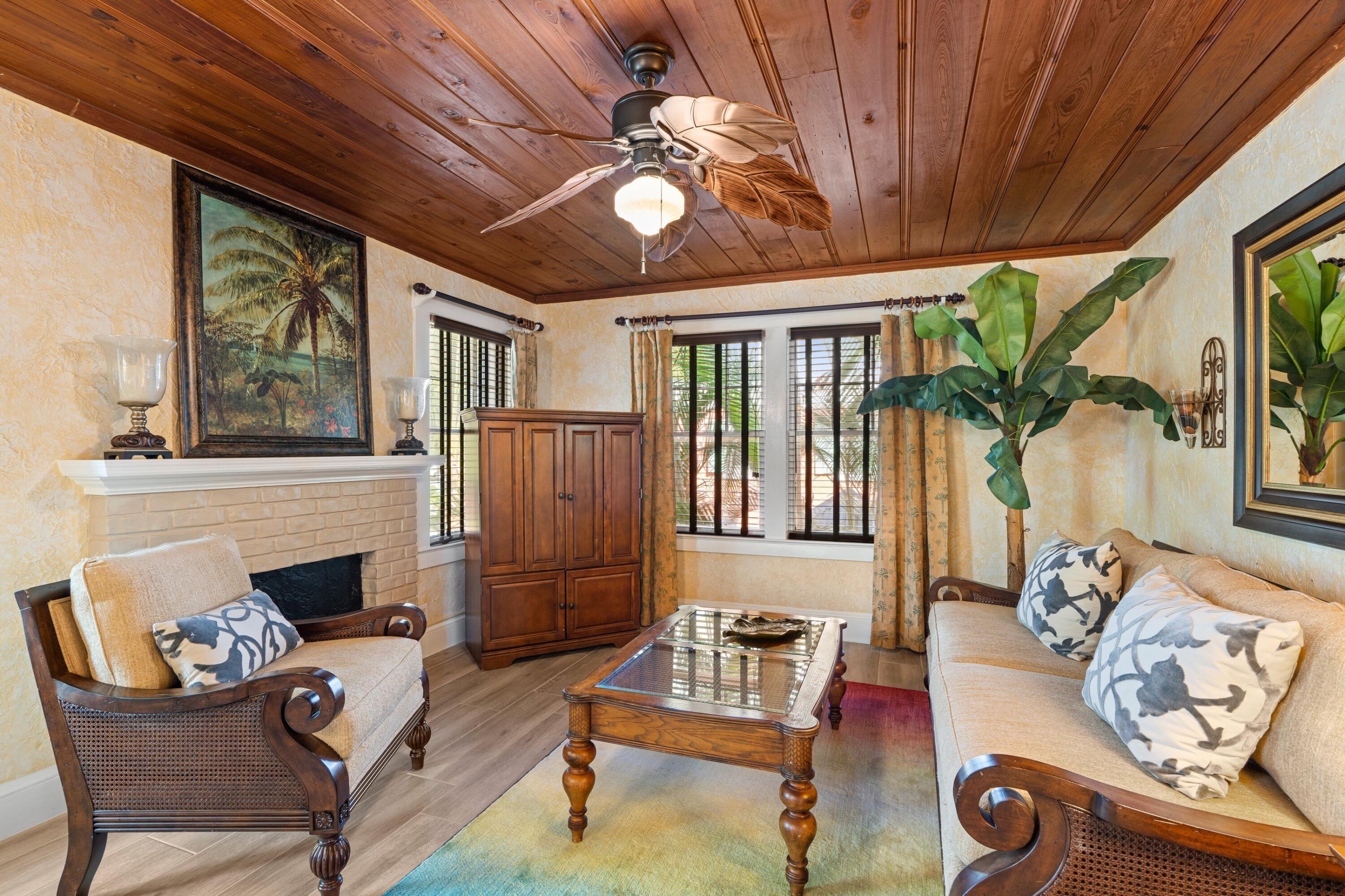 102 Southeast 7th Avenue, Unit VILLA 4 Delray Beach, FL 33483 - Photo 8 of 23 a living room with furniture and a fireplace