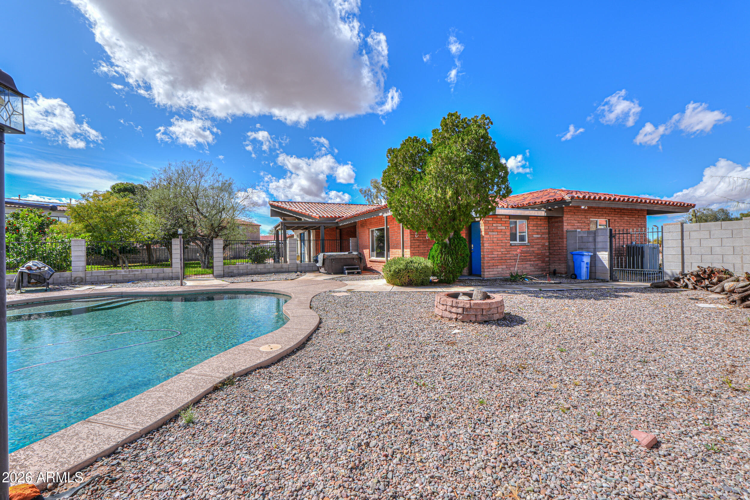 340 North Pottebaum Road Casa Grande, AZ 85122 - Photo 34 of 49 a view of a house with swimming pool and a yard