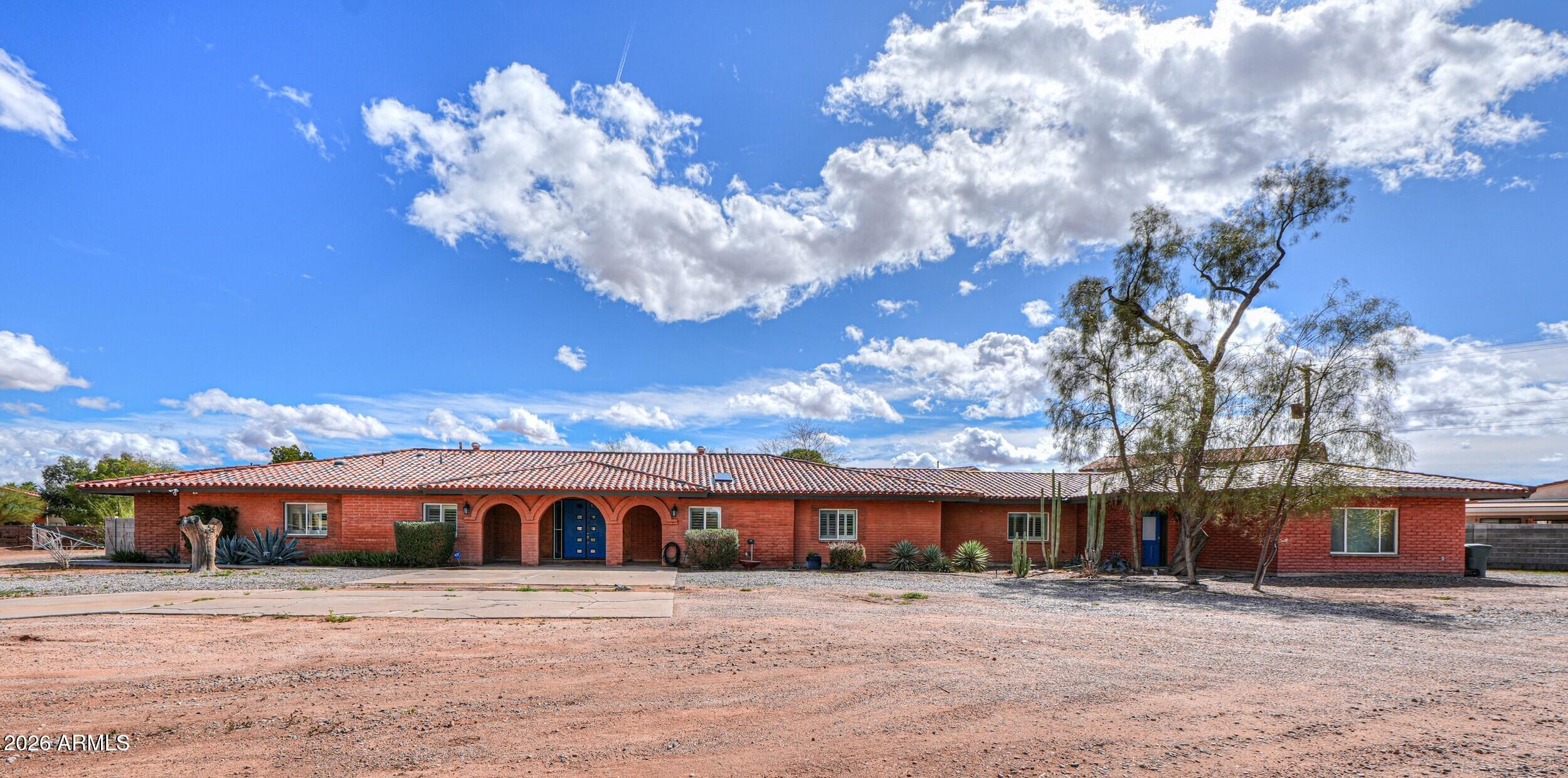 340 North Pottebaum Road Casa Grande, AZ 85122 - Photo 3 of 49 a front view of a house with a yard