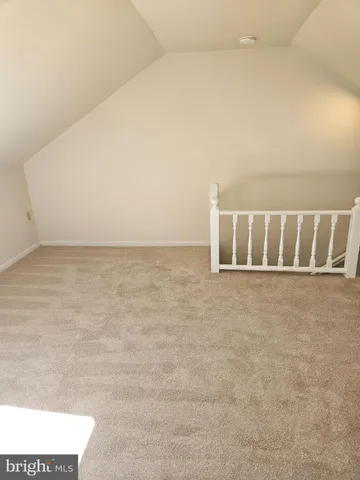 a view of a living room and chandelier