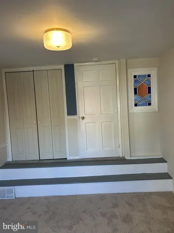 a view of gallery with wooden floor