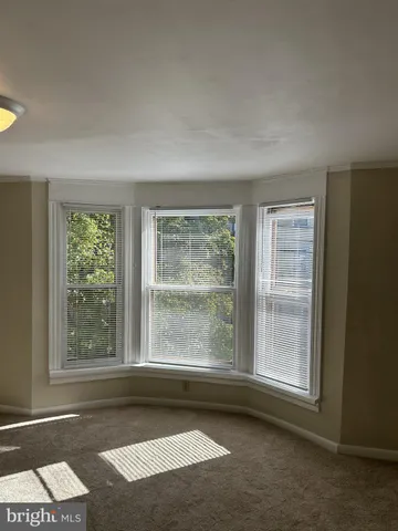 a front view of a house with parking space