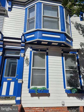 a kitchen with wooden cabinets stainless steel appliances and a counter space