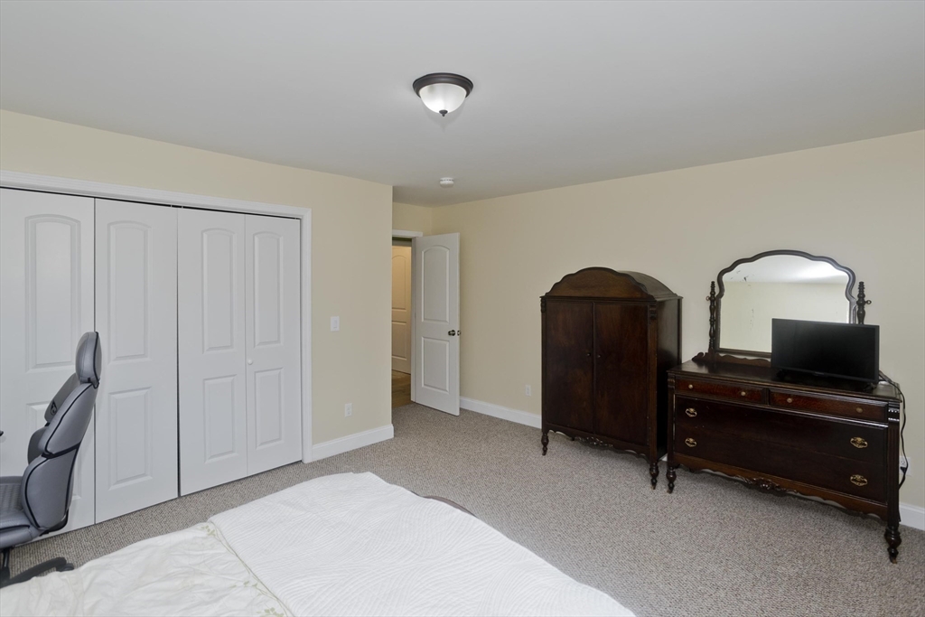 48 Mountain Avenue West Springfield, MA 01089 - Photo 21 of 39 a bedroom with a bed and a bathroom