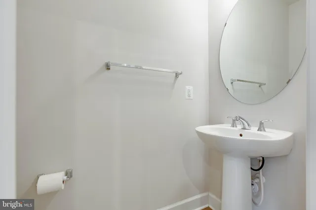 a bathroom with a sink and mirror