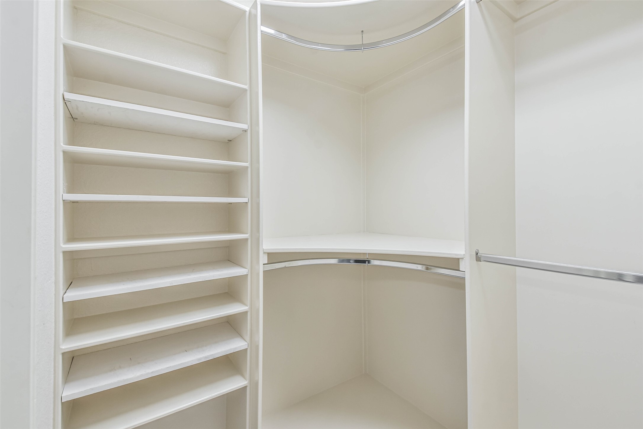 20942 Wind Field Lane Spring, TX 77379 - Photo 33 of 46 a view of walk in closet with empty racks