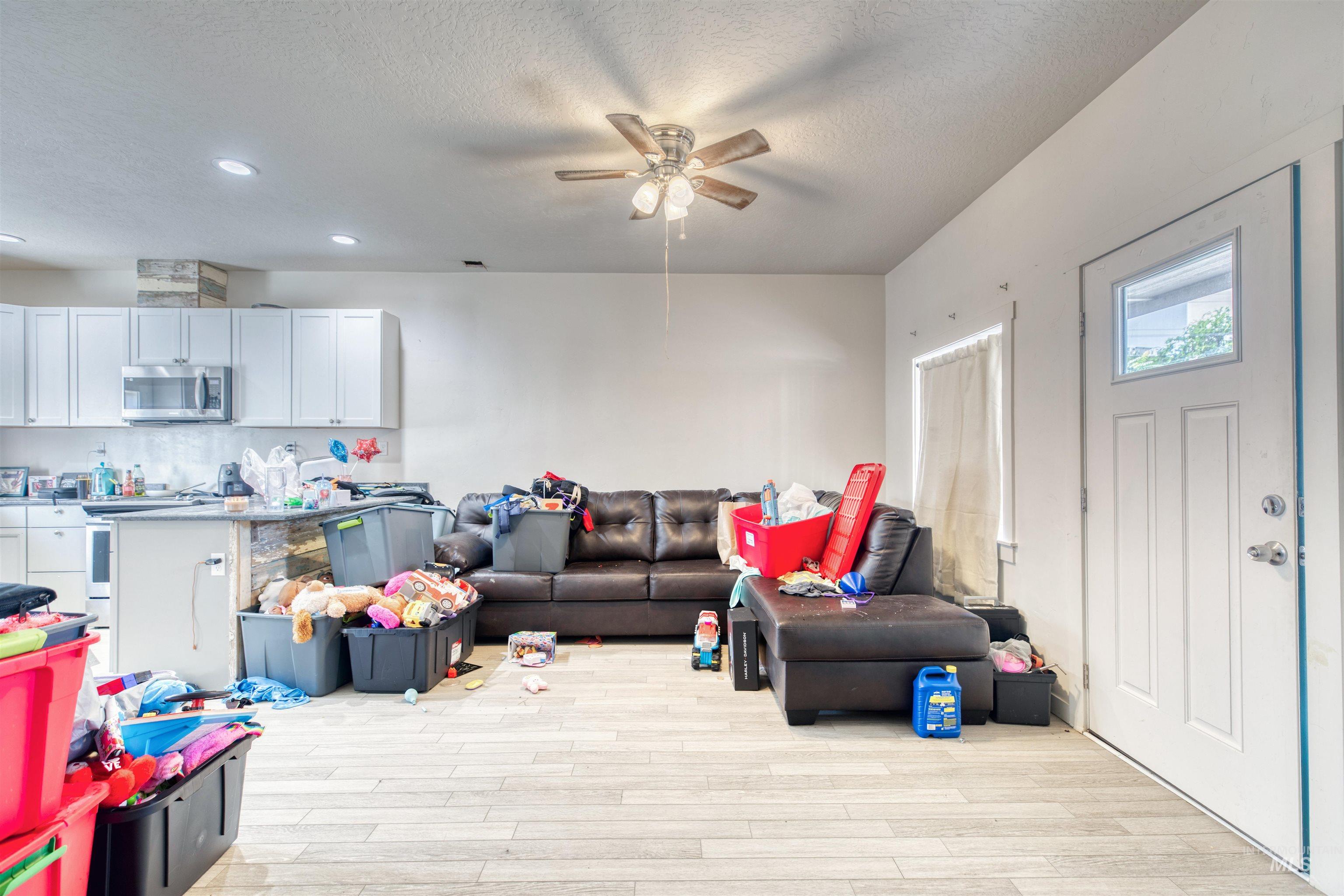 112 East Main Street Nyssa, OR 97913 - Photo 33 of 43 Living room featuring a ceiling fan, light wood-type flooring, a textured ceiling, and recessed lighting