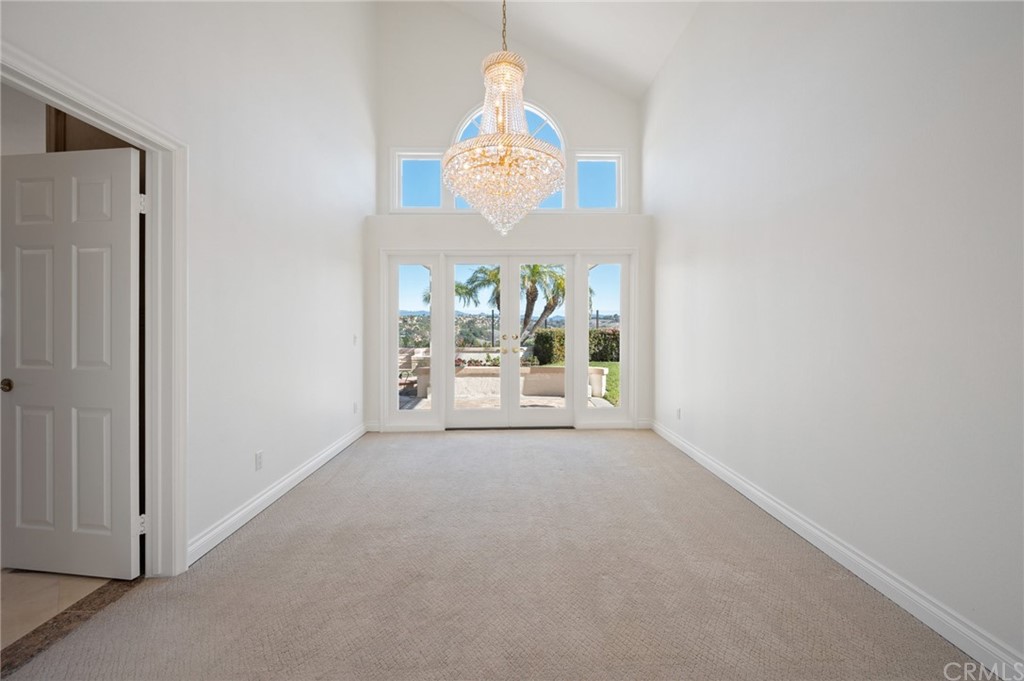 16 Charmony Laguna Niguel, CA 92677 - Photo 12 of 36 a view of a room with a chandelier fan and windows
