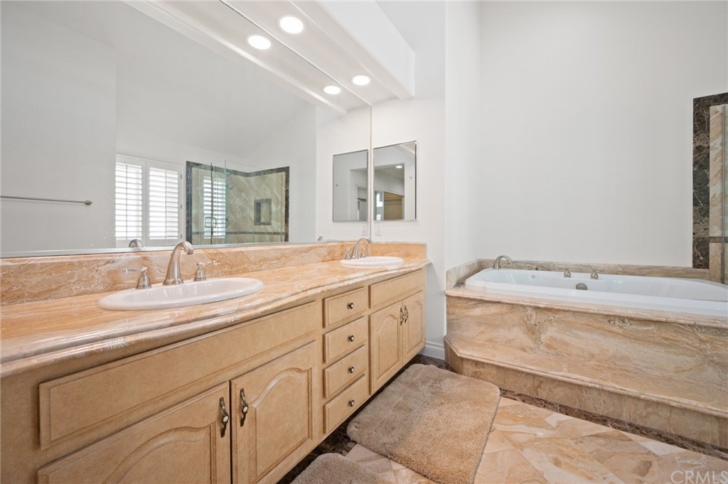 16 Charmony Laguna Niguel, CA 92677 - Photo 15 of 36 a spacious bathroom with double sink and a large mirror
