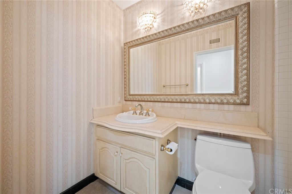 16 Charmony Laguna Niguel, CA 92677 - Photo 22 of 36 a bathroom with a sink and a mirror