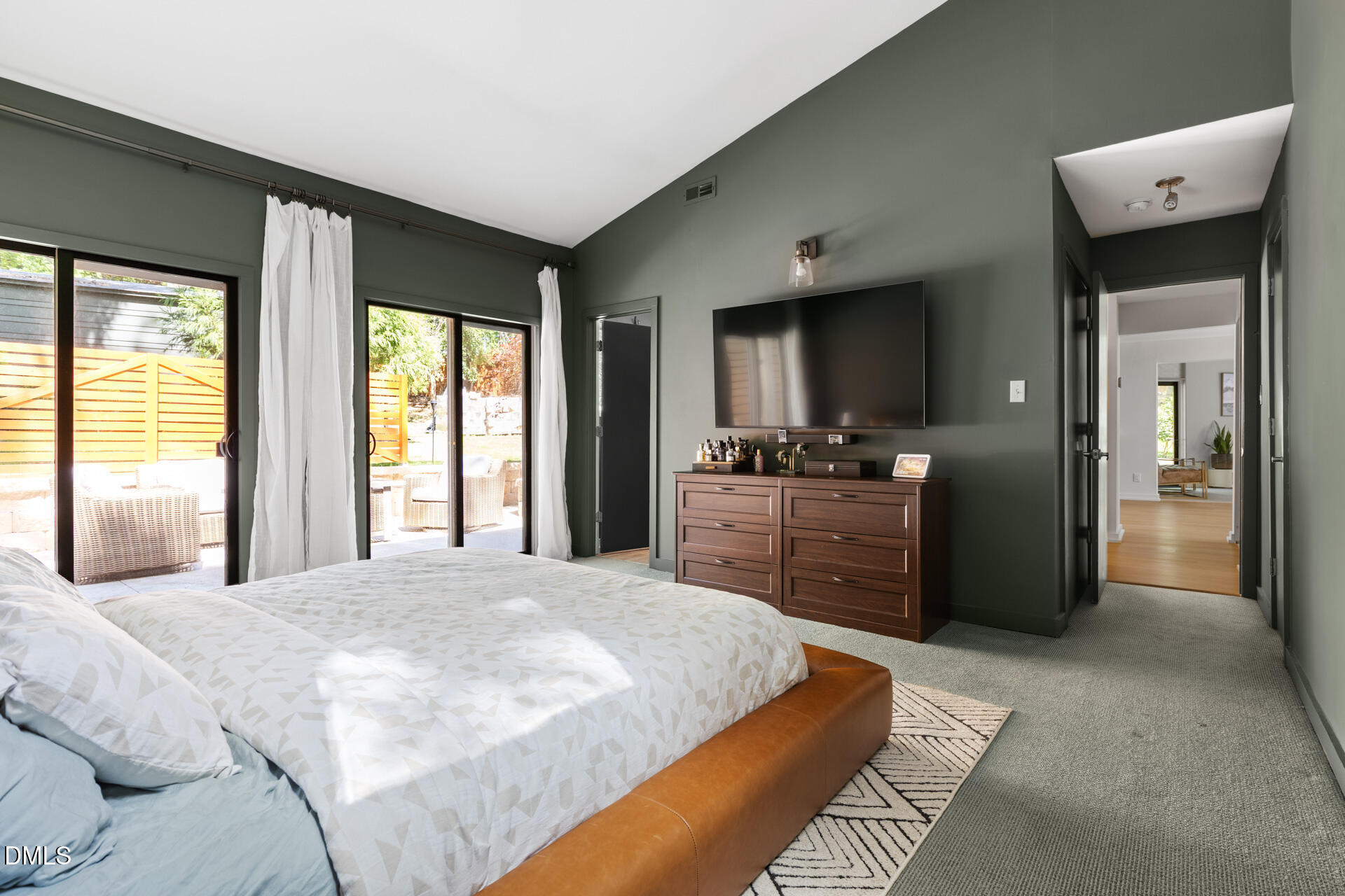 5208 Saddle Court Raleigh, NC 27609 - Photo 26 of 43 a large bedroom with a bed and a large window