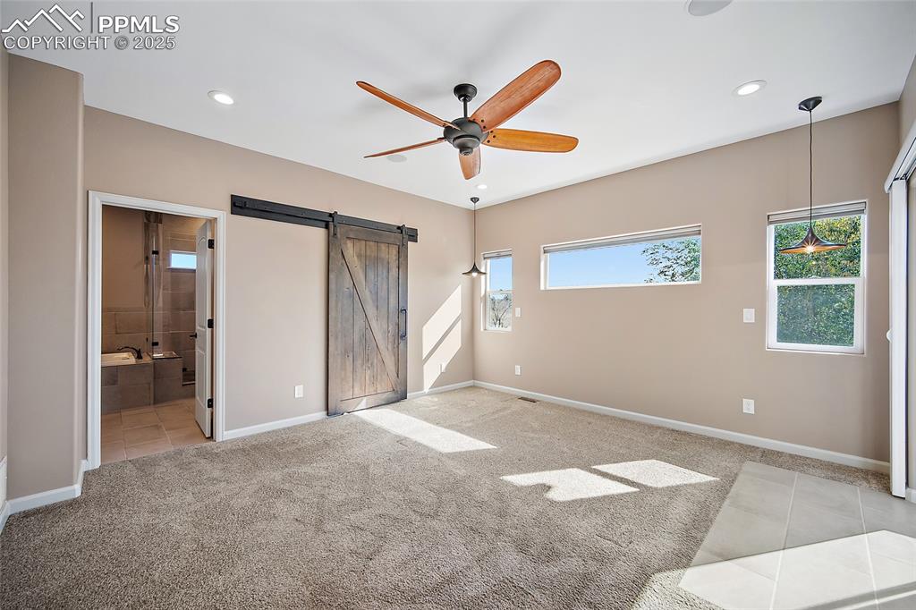 633 Tierra Verde Court Colorado Springs, CO 80904 - Photo 19 of 50 a view of a livingroom with a ceiling fan and window