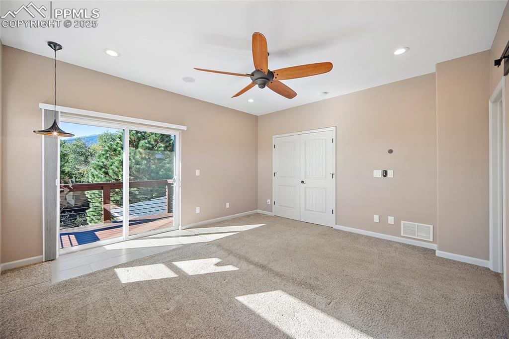 633 Tierra Verde Court Colorado Springs, CO 80904 - Photo 20 of 50 a view of an empty room with window and ceiling fan