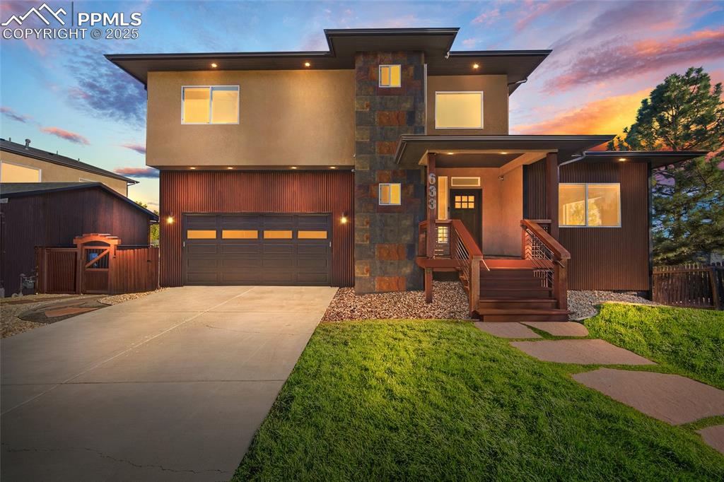 633 Tierra Verde Court Colorado Springs, CO 80904 - Photo 2 of 50 a front view of a house with a yard