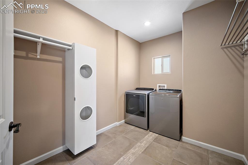 633 Tierra Verde Court Colorado Springs, CO 80904 - Photo 28 of 50 a view of a hallway with washer and dryer