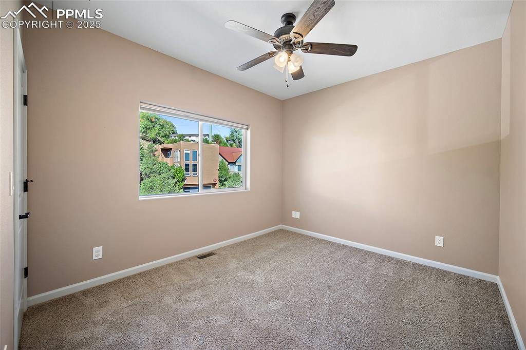 633 Tierra Verde Court Colorado Springs, CO 80904 - Photo 29 of 50 an empty room with a window