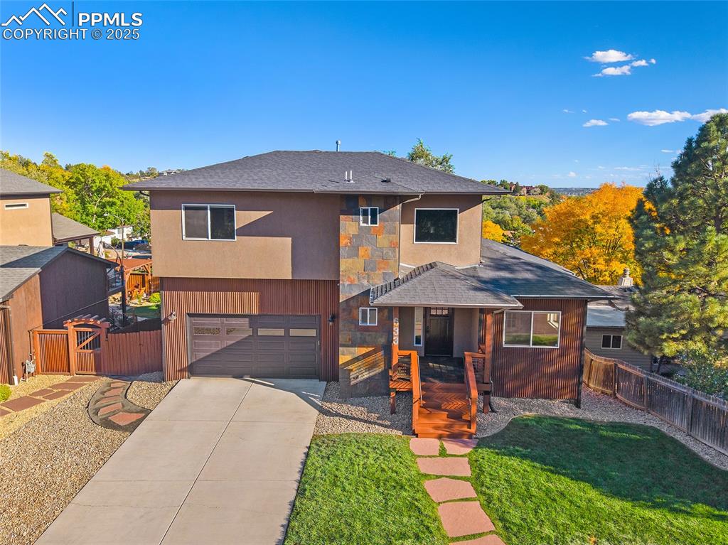 633 Tierra Verde Court Colorado Springs, CO 80904 - Photo 3 of 50 a front view of a house with garden
