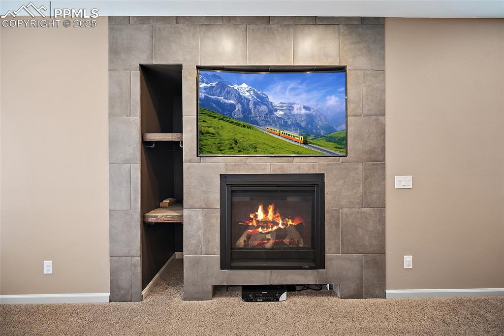 633 Tierra Verde Court Colorado Springs, CO 80904 - Photo 35 of 50 a room with fireplace