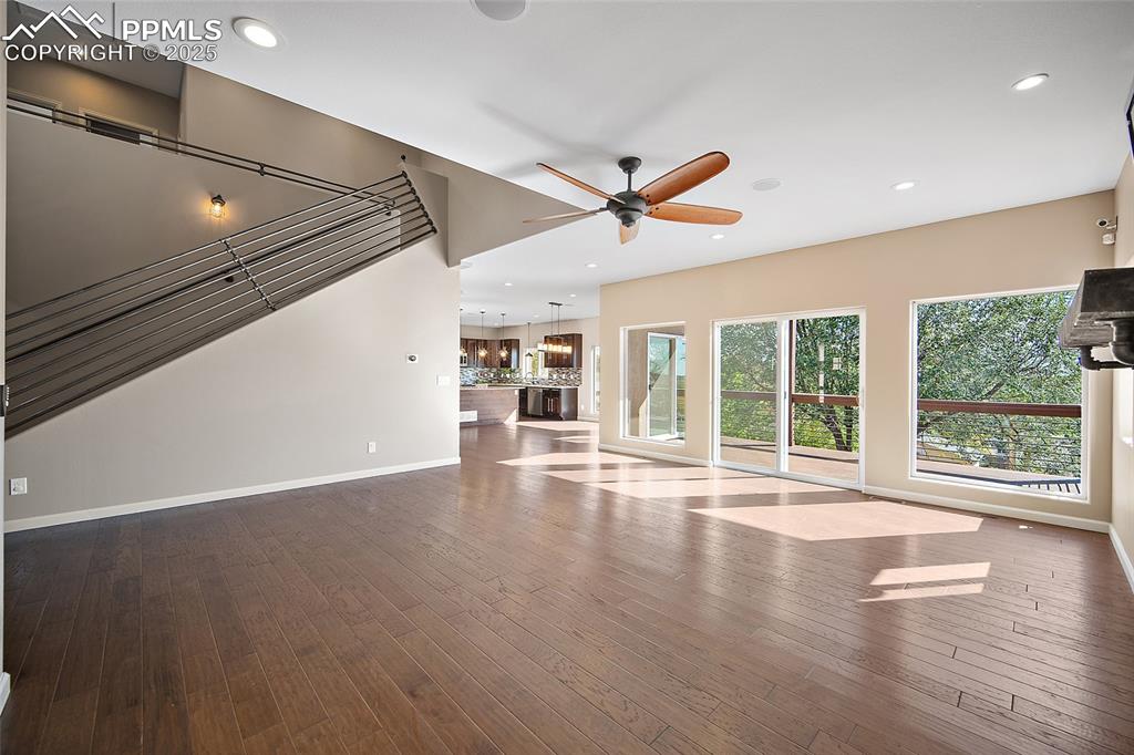 633 Tierra Verde Court Colorado Springs, CO 80904 - Photo 9 of 50 a view of empty room with wooden floor and fan