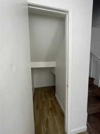 a living room with furniture and stairs