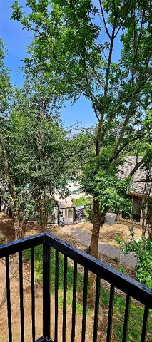a view of a forest from a balcony