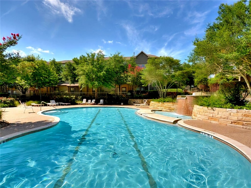 11203 Ranch Road 2222, Unit 107 Austin, TX 78730 - Photo 28 of 33 a view of swimming pool with an outdoor space and seating area