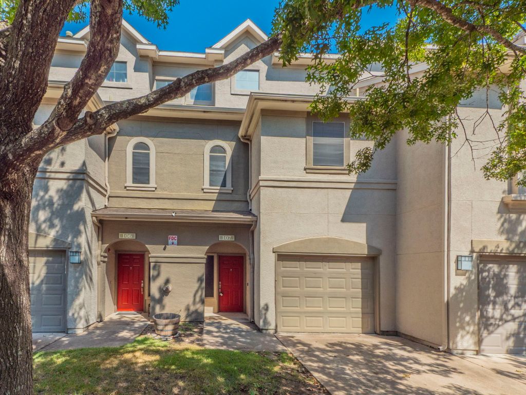 11203 Ranch Road 2222, Unit 107 Austin, TX 78730 - Photo 3 of 33 a front view of a house with garage