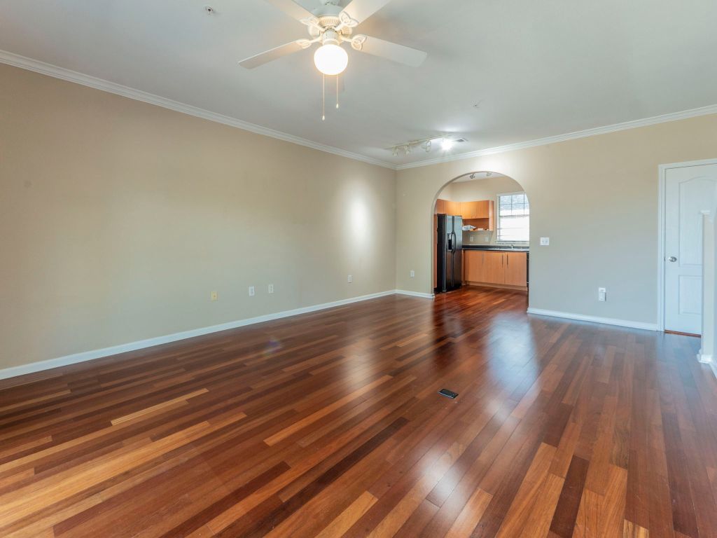 11203 Ranch Road 2222, Unit 107 Austin, TX 78730 - Photo 5 of 33 a view of empty room with wooden floor