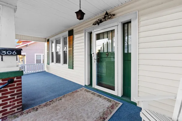 a backyard of a house with lots of green space and fountain